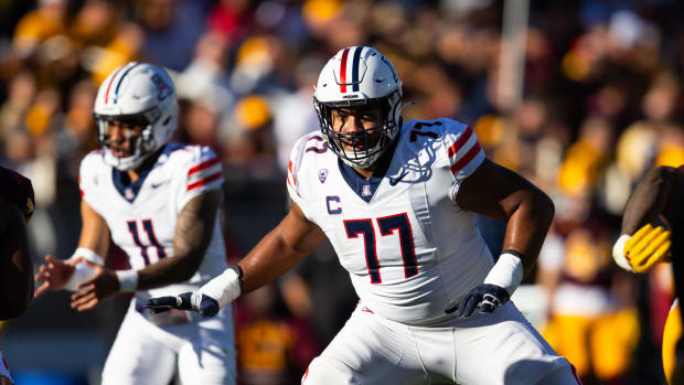 Nov 25, 2023; Tempe, Arizona, USA; Arizona Wildcats offensive lineman Jordan Morgan (77) against the Arizona State Sun Devils during the Territorial Cup at Mountain America Stadium.